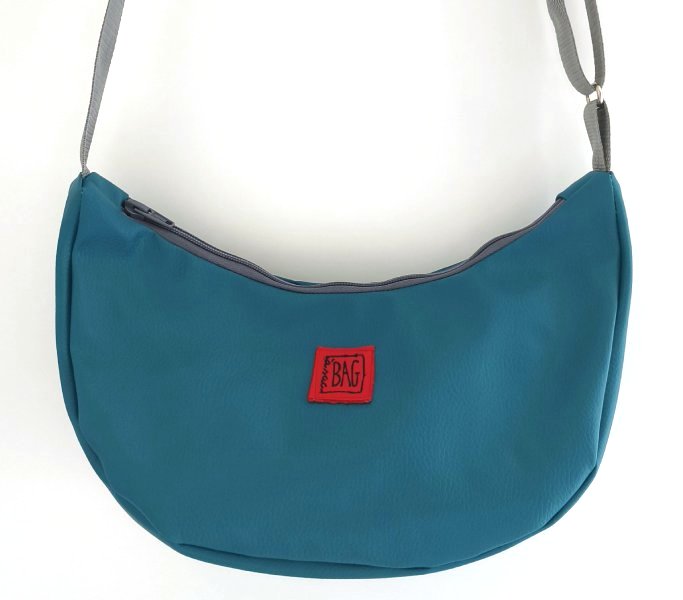 Brinco polipiel turquesa i complements gris